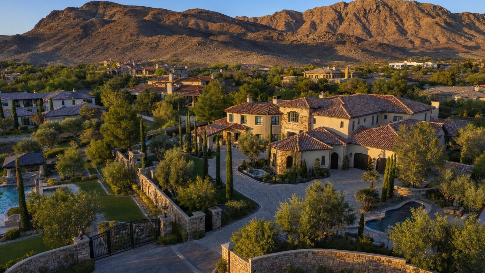 Calico Ridge Henderson Mediterranean custom luxury estate exterior with hillside grade and Strip view in background