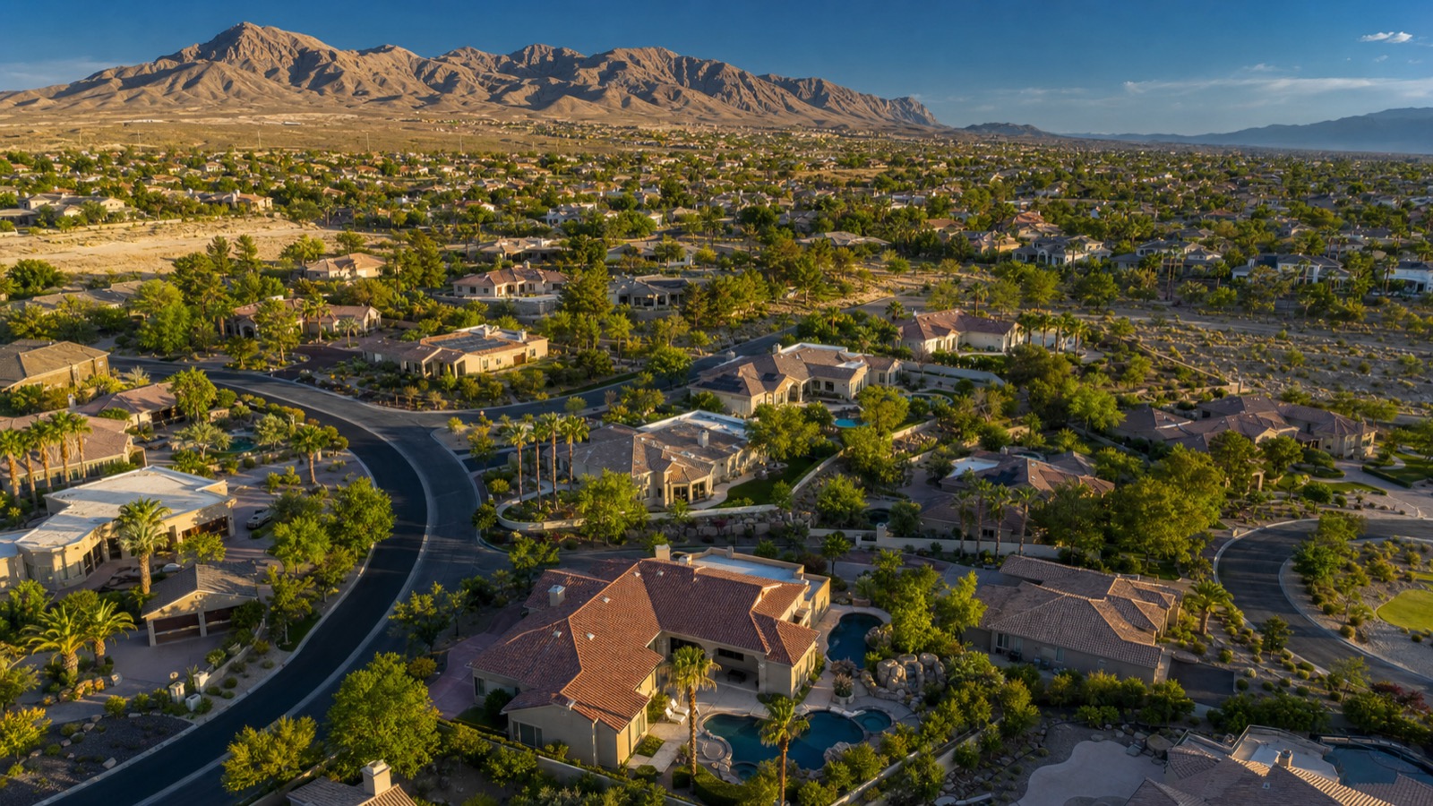 McCullough Range and Henderson hillside foothills at golden hour with Mediterranean luxury estates
