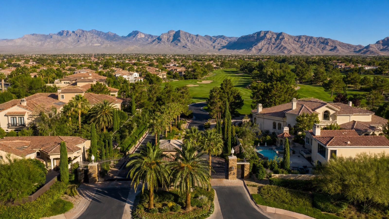 Canyon Gate Country Club Las Vegas Mediterranean luxury estate streetscape with mature palm trees and paver driveways