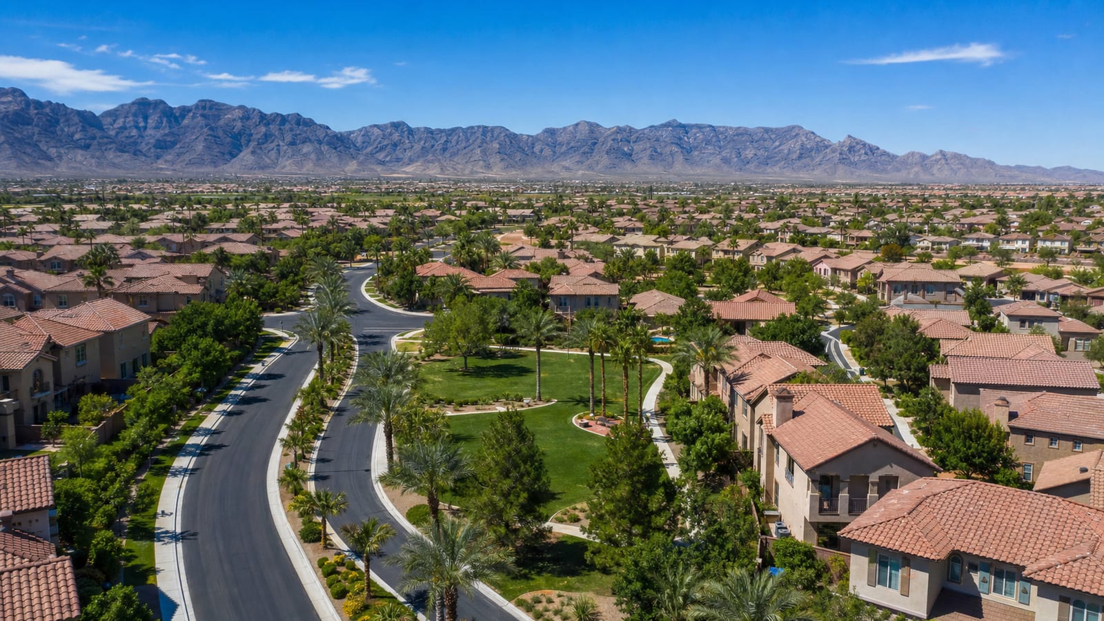 Centennial Hills Las Vegas family suburban neighborhood at golden hour with single-family homes, mature streets, and well-kept landscaping