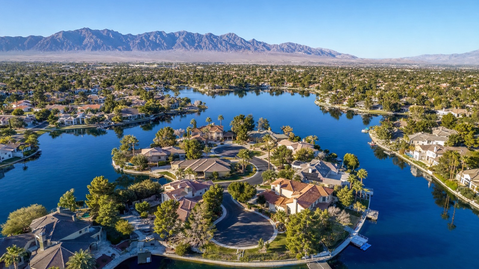 Desert Shores Las Vegas lakefront home with private dock and patio overlooking private lake