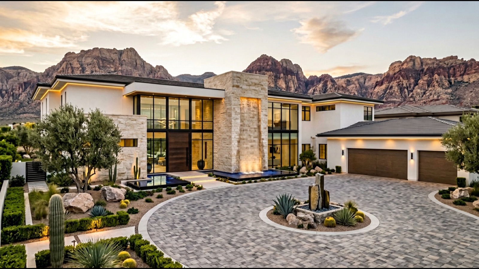 Mesa Ridge premium view-lot estate home with contemporary architecture infinity pool integrated outdoor great room and Red Rock Canyon escarpment view at golden hour