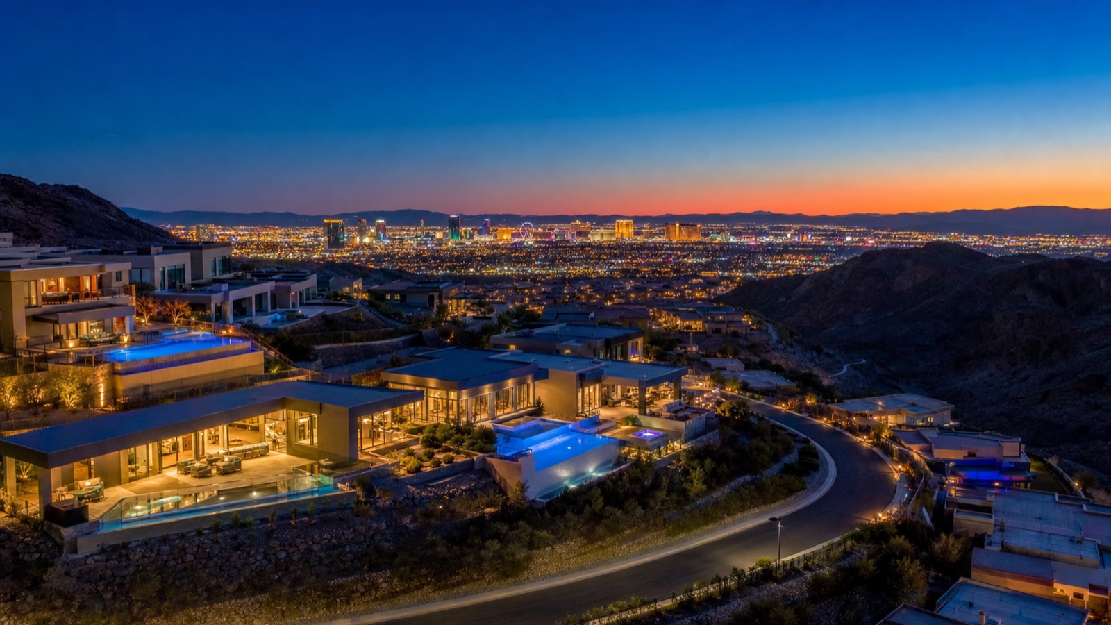 Roma Hills Henderson hillside community at twilight with Las Vegas Strip view from upper terraces