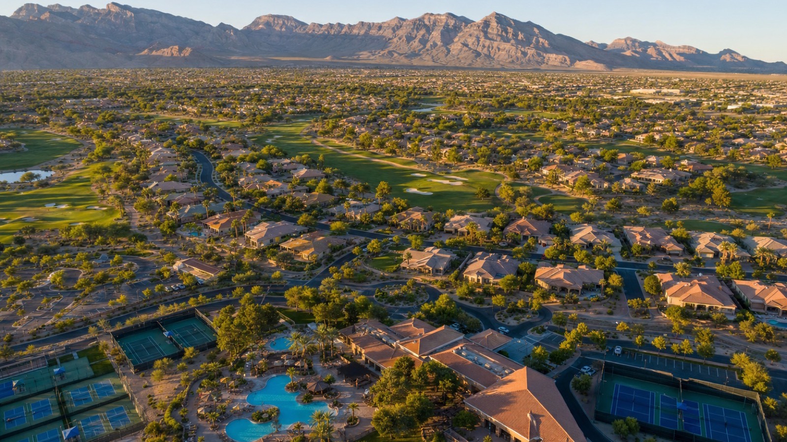 Aerial view of Sun City Summerlin 55+ active adult community showing manicured golf course, residential streets, and community center