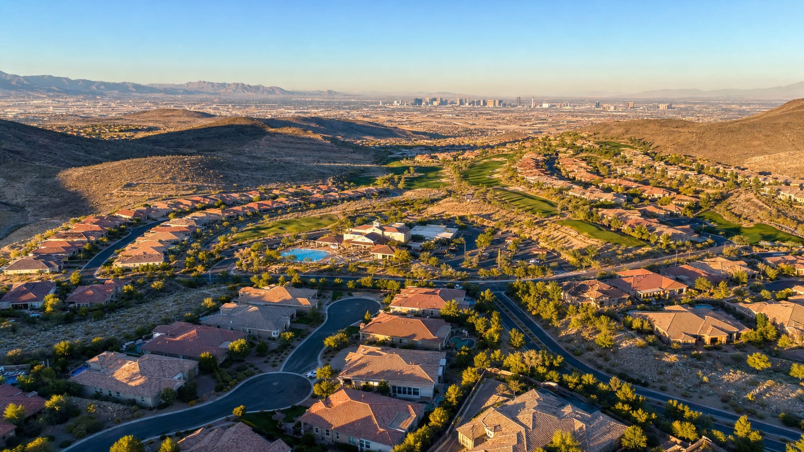 Sun City Anthem hillside aerial view across the Henderson foothills with the Las Vegas valley spread out below