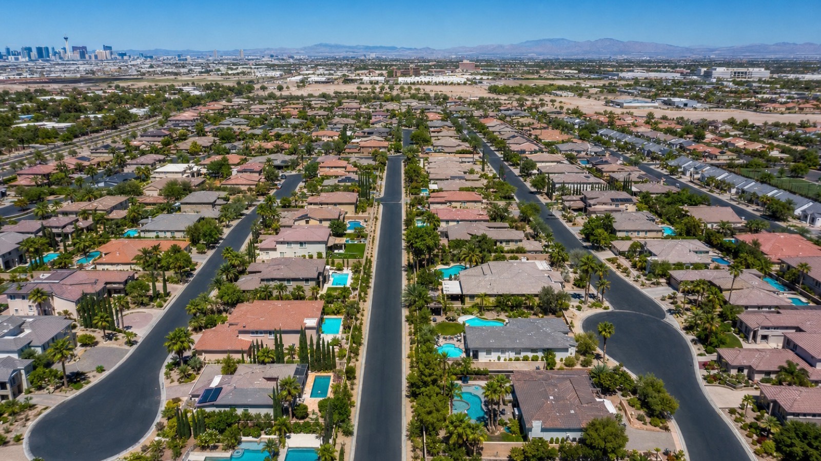 Aerial view of Sunrise Manor's grid residential pattern from above showing established 1970s-2000s detached inventory blocks with mature landscaping