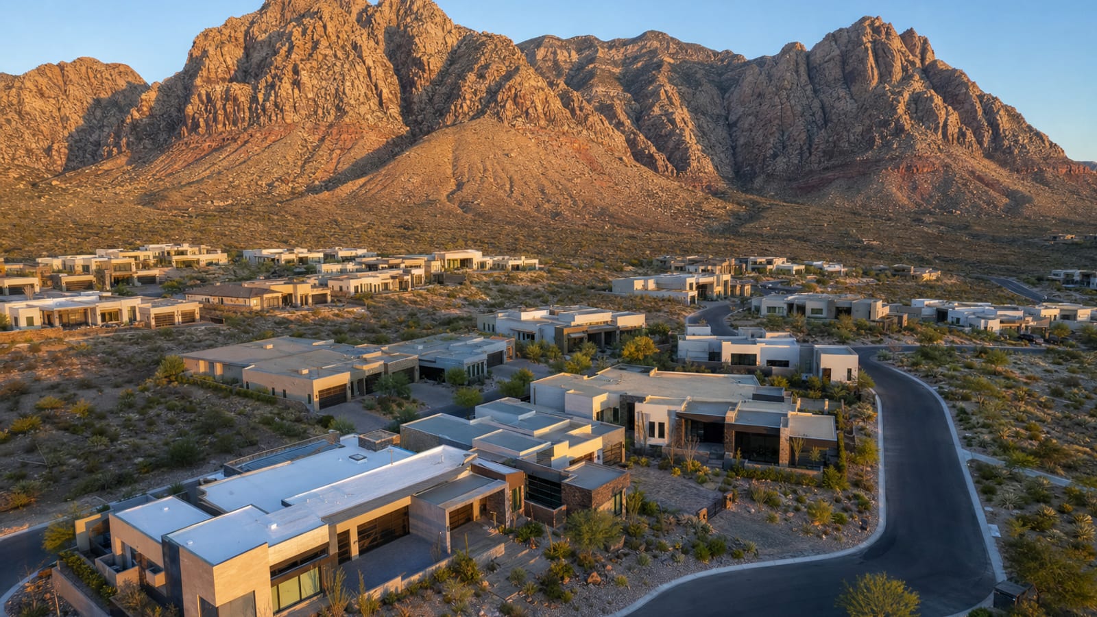 The Cliffs Summerlin West village aerial showing contemporary homes built into the elevated foothills directly above Red Rock Canyon