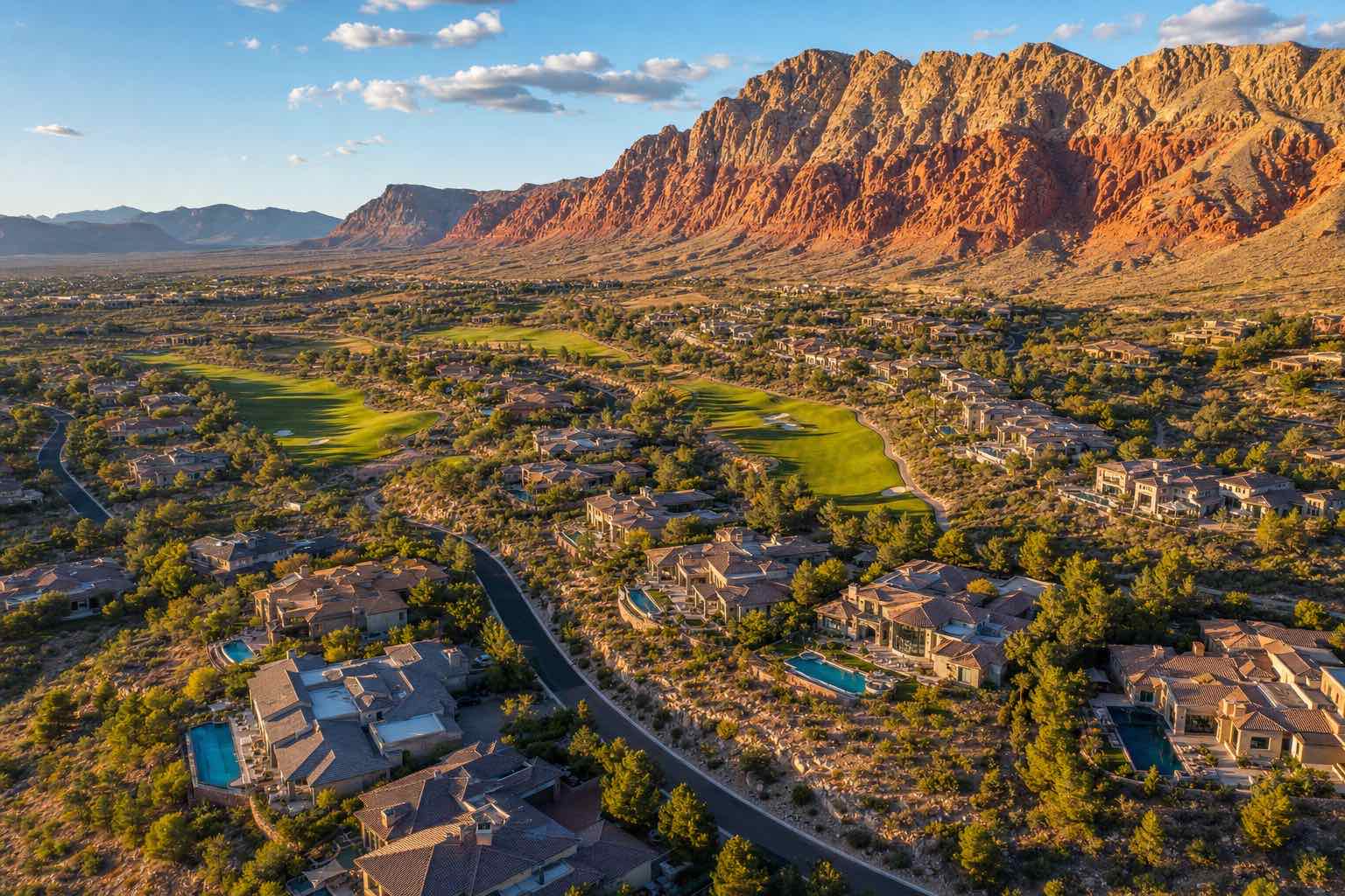 Aerial view of The Ridges in Summerlin — guard-gated luxury estates above TPC Summerlin with Red Rock Canyon and Spring Mountains backdrop, Las Vegas, Nevada